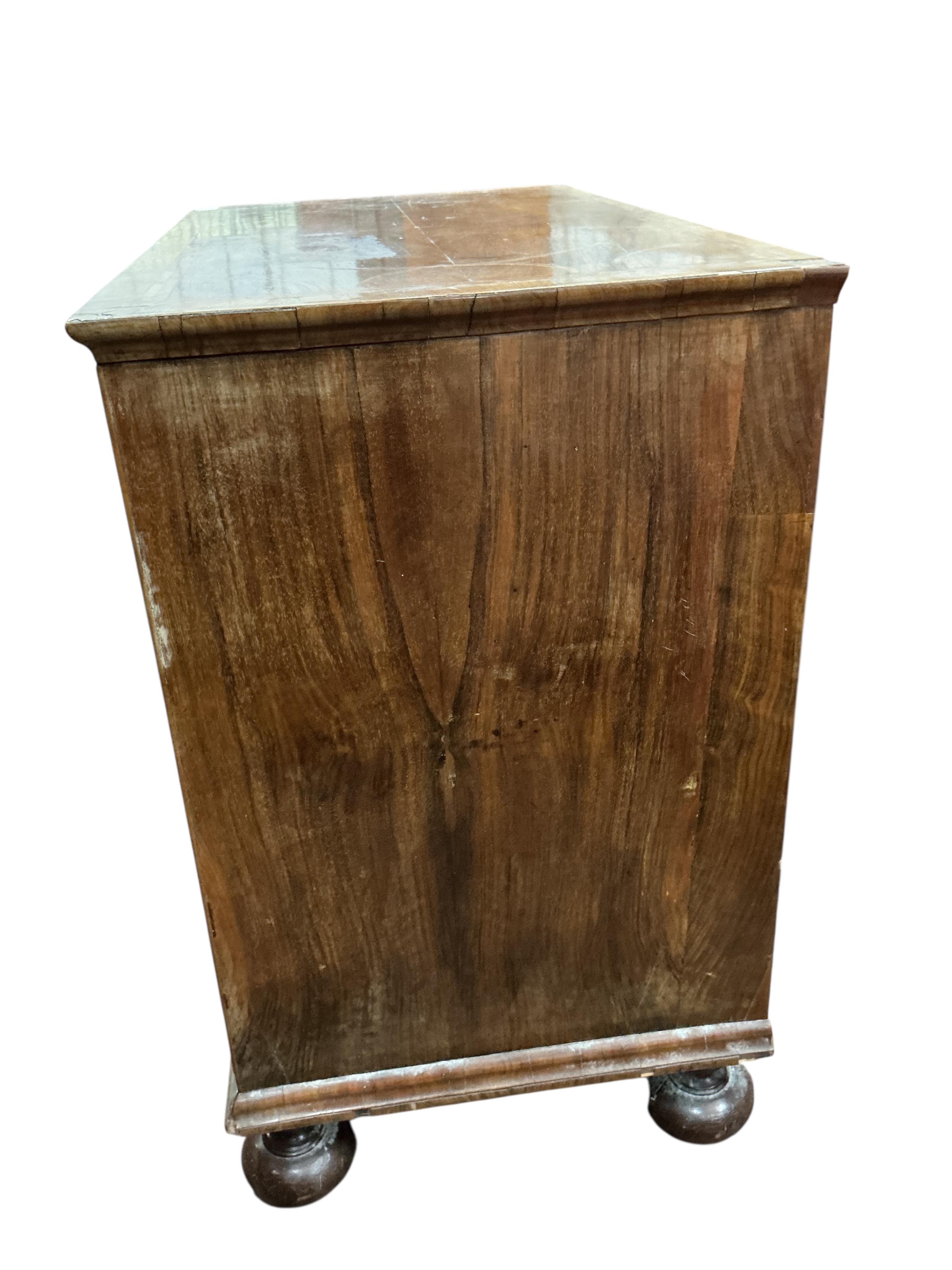 An early 18th century feather banded walnut chest, damaged, width 95cm, depth 54cm, height 91cm